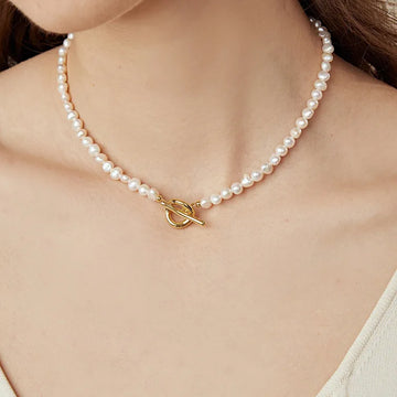 Sophia Pearl Toggle Necklace with high-quality pearls on a woman's neck.