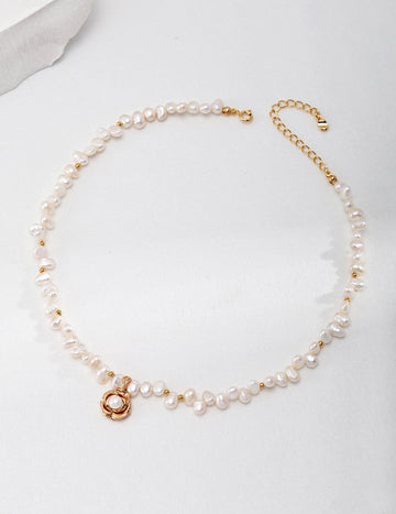 Camellia Pearl Necklace with gold chain and camellia pendant.