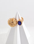 The Blue and Chry Ring featuring chrysanthemum flower and blue stone design.