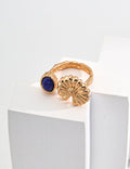 The Blue and Chry Ring featuring chrysanthemum flower and blue gemstone design.