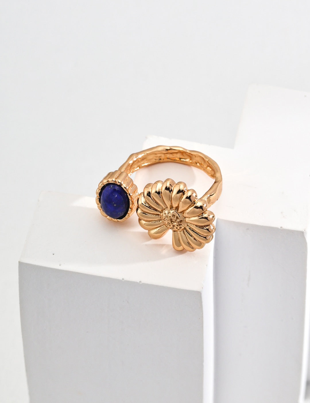 The Blue and Chry Ring featuring chrysanthemum flower and blue gemstone design.