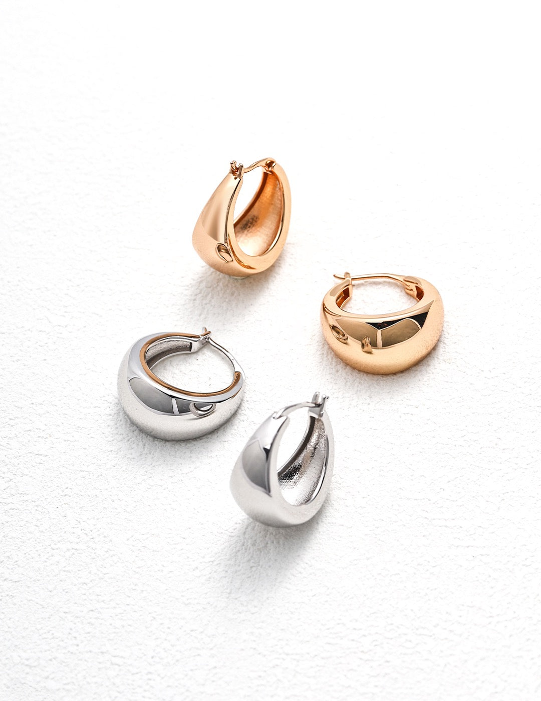 Alla Hoop Earrings in gold and silver, stylish and elegant design for everyday wear.