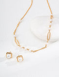 Zena Pearl Chain Link Necklace with chain and pearl detailing.