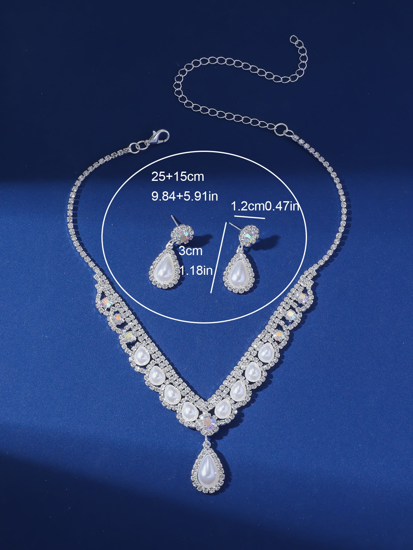 Camelia Pearl Droplet Bridal Set with necklace and earrings on blue background.