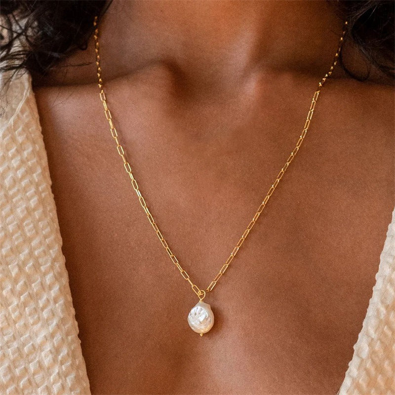 Small-link chain pearl pendant necklace with stainless steel and 14K gold plating.